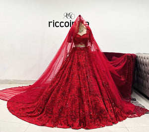 Dark red train Lehenga with shoulder dupatta and head veil