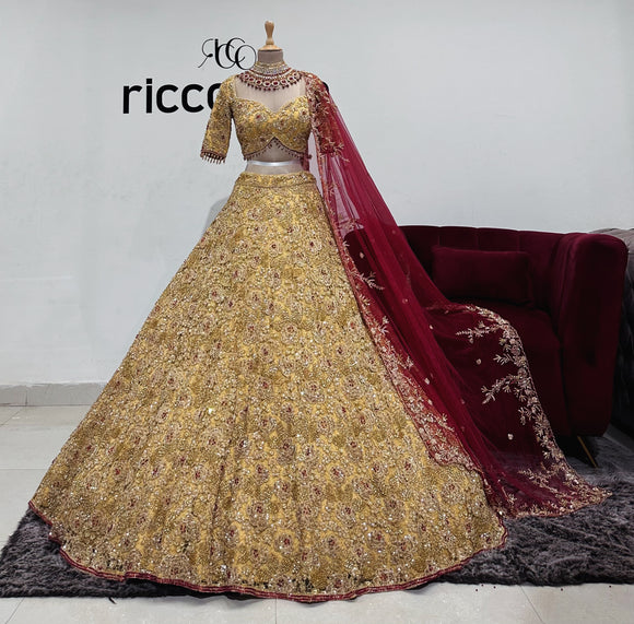 GOLD LACE EMBROIDERY LEHENGA WITH CONTRASTING RED DUPATTA