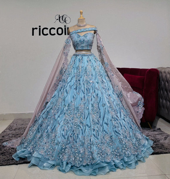 AQUA BLUE ORGANZA LEHENGA WITH ROSE CRYSTALS & CAPES