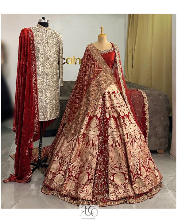 Silver lehenga with mirrorwork blouse and feather dupatta