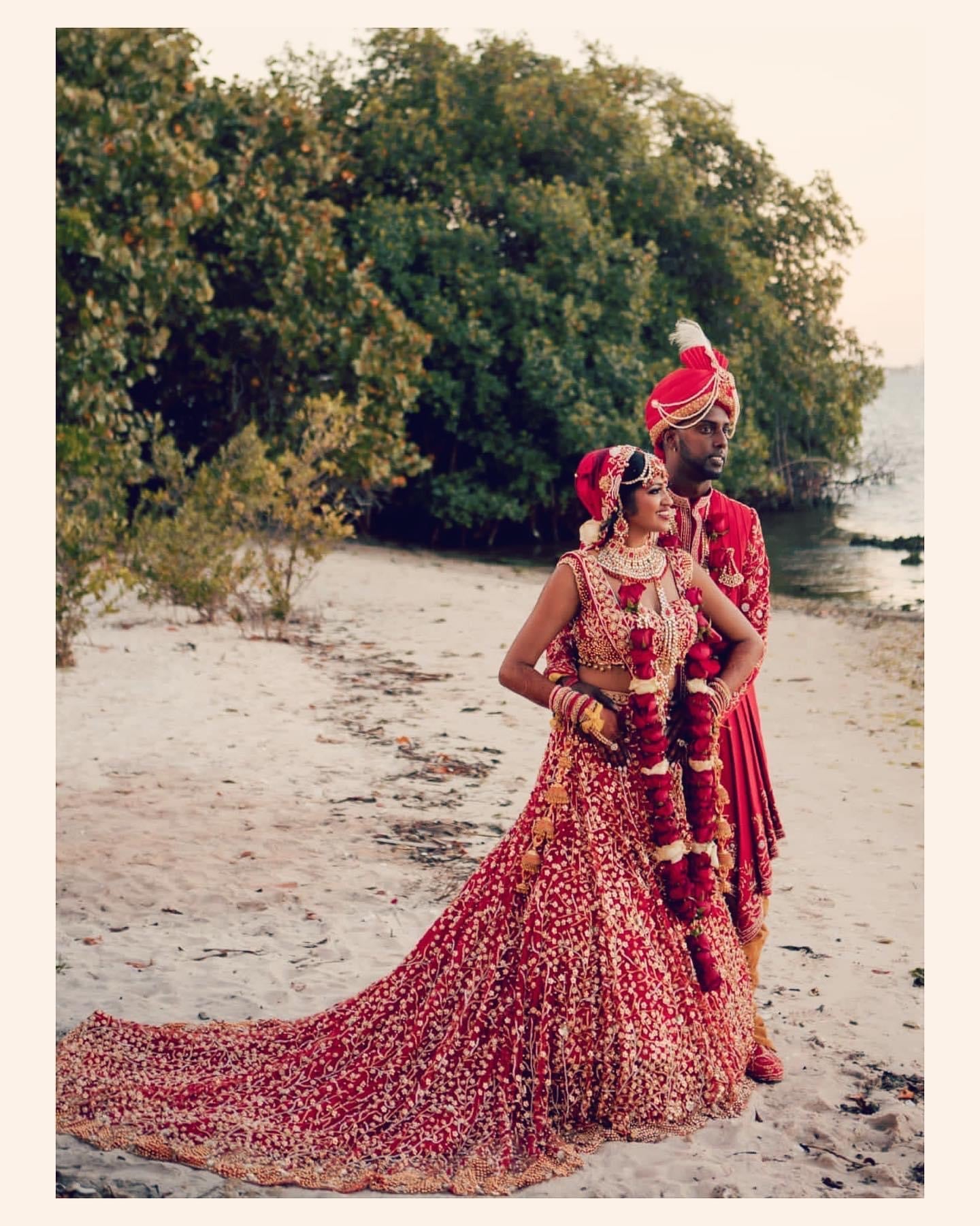 Groom sherwani with red lehenga best sale